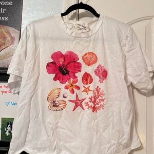White T-Shirt with Pink Floral and Seashell Design